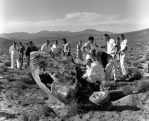 The wreckage of the forward fuselage of X-15 no. 3 after crash that killed pilot Michael Adams on 15 November 1967. NASA and US Air Force personnel examine the remains in order to determine the cause of the tragedy. X-15 pilot Milt Thompson can be seen in 