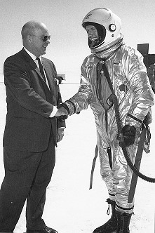 Joe Walker is greeted by Paul Bikle, the director of the X-15 program, after his record altitude flight on 22 August 1963. This was Walker's third and final astronaut qualification flight in the X-15, and was also his last flight in the program..